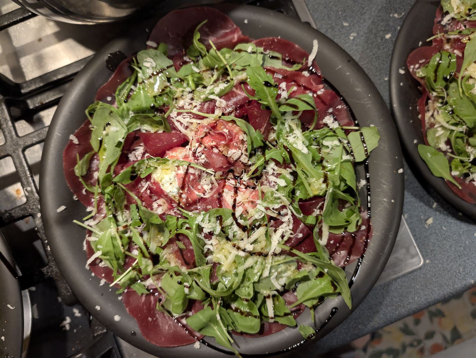 Carpaccio con rucola e grana